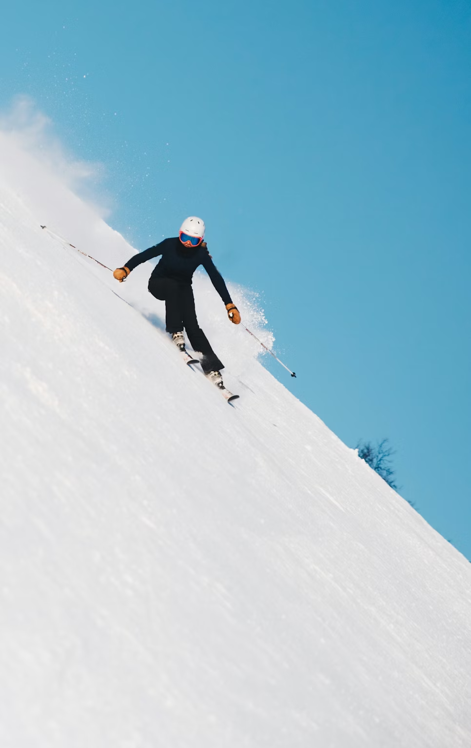 Skier riding down a slope